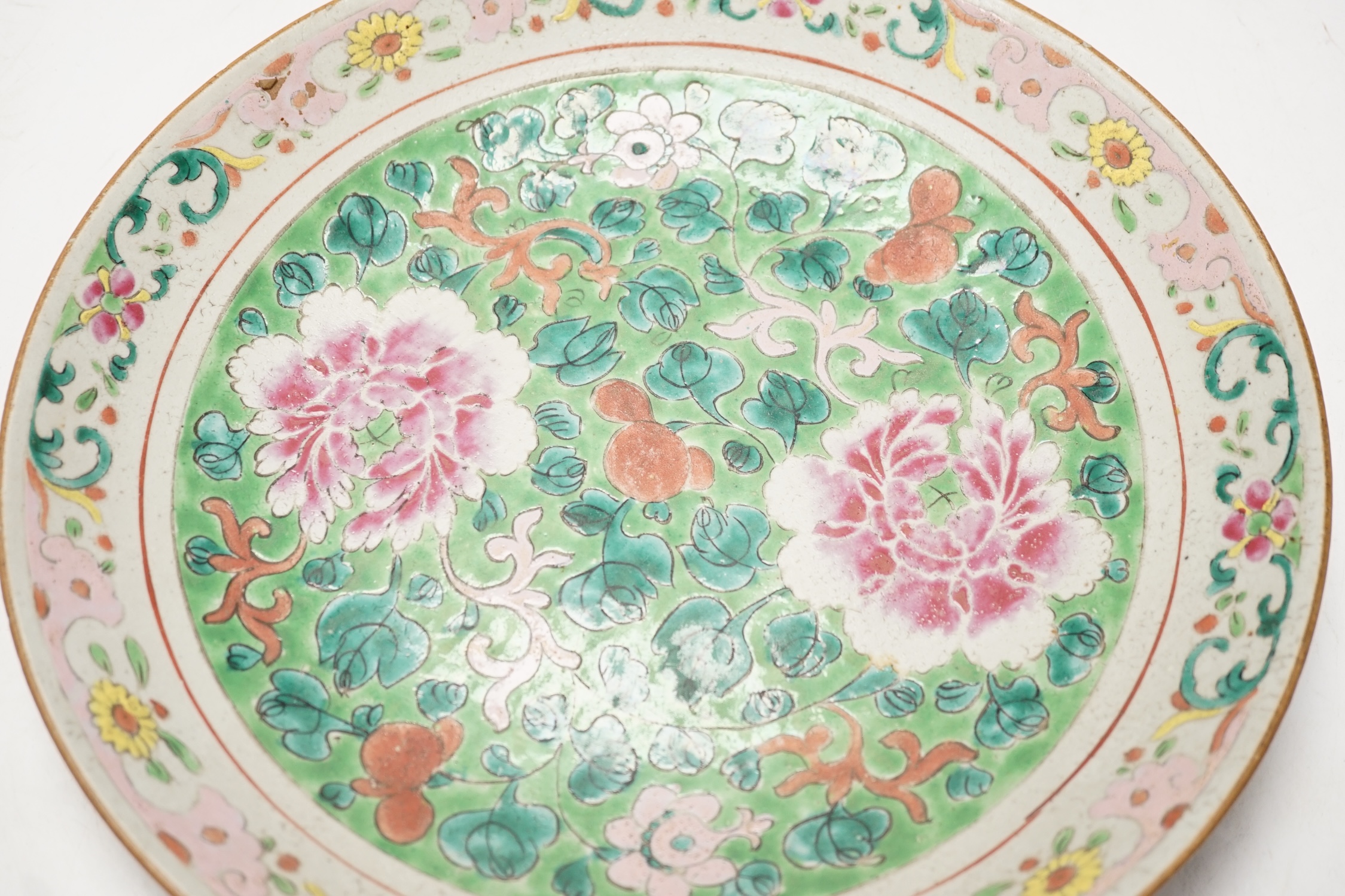 A 19th century Chinese famille rose dish, possibly Thai market, 32cm diameter. Condition - poor to fair